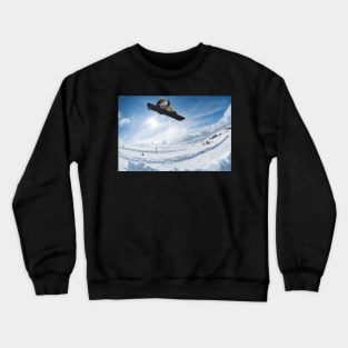 Snowboarder jumping against blue sky Crewneck Sweatshirt